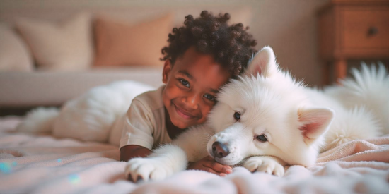 Boy and dog next to each other, their head is resting on top of each other.